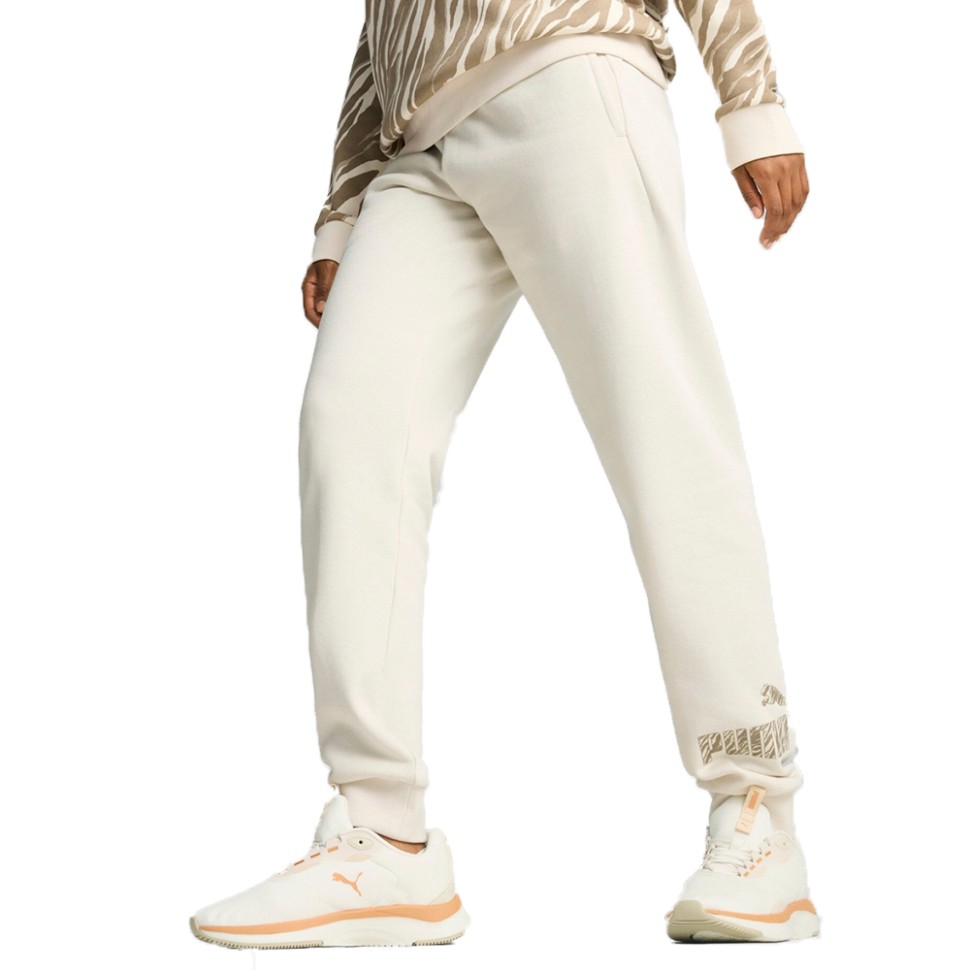 Штани жіночі Puma ESS+ ANIMAL Pants FL молочні 68149687 — фото 1