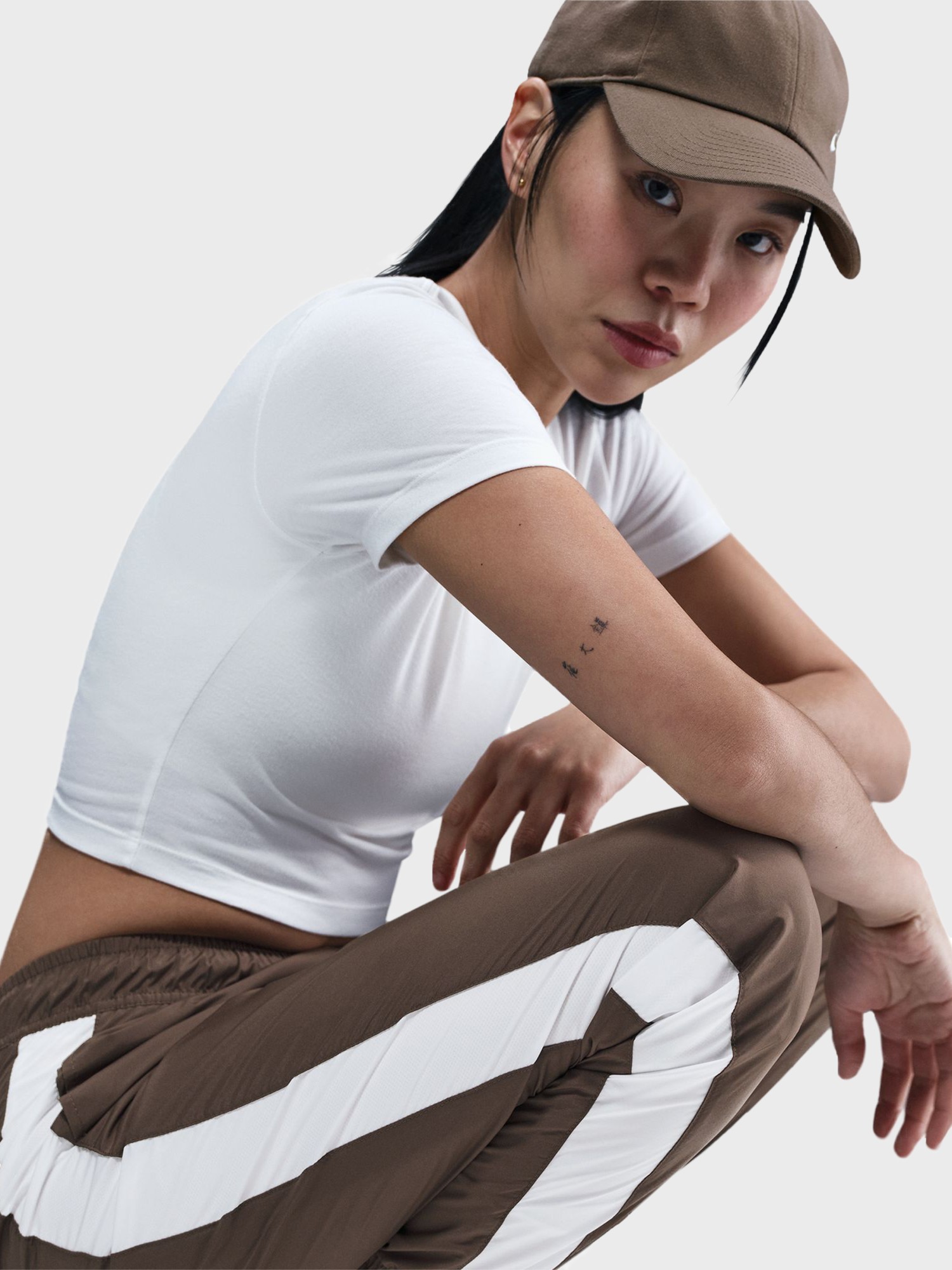 Штани жіночі Nike W NSW OTG UV ESSNTL WVN MR JG коричневі FV7660-004 изображение 6